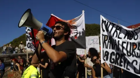 Countrywide Walkouts Begin Against Fiscal Slashing